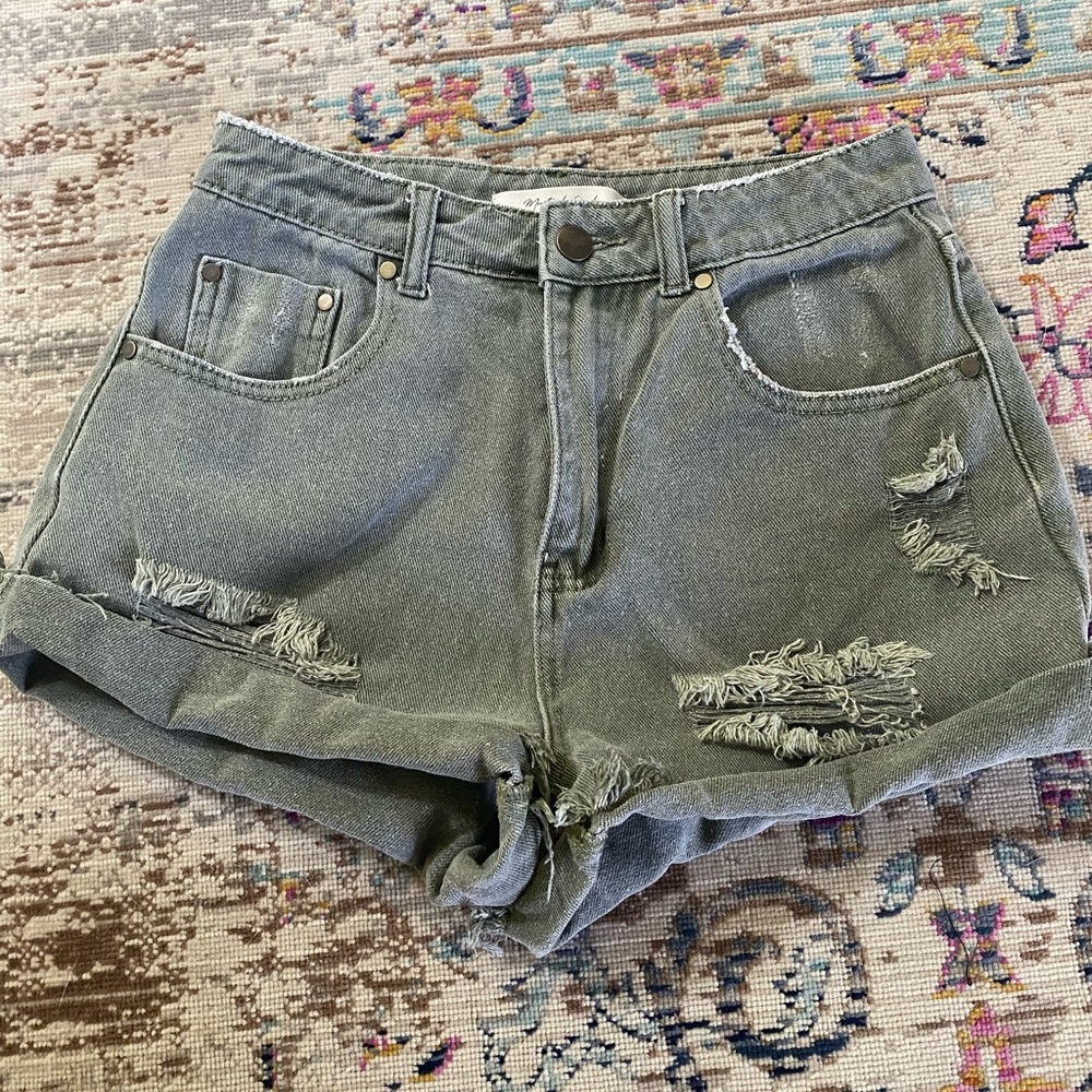 Green distressed denim shorts